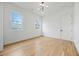 Cozy bedroom with hardwood floors, two windows, and modern lighting at 1137 Hardee Ne St # B, Atlanta, GA 30307