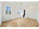 Bright bedroom with hardwood floors, fresh paint, modern lighting, and windows offering natural light at 1137 Hardee Ne St # B, Atlanta, GA 30307