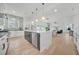 Open concept kitchen with white cabinetry, marble island, and stainless steel appliances at 1137 Hardee Ne St # B, Atlanta, GA 30307