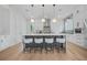 Stylish kitchen with white cabinets, a large central island, and modern pendant lighting at 1137 Hardee Ne St # B, Atlanta, GA 30307