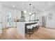 Bright kitchen featuring white cabinets, a large island with seating, and stainless steel appliances at 1137 Hardee Ne St # B, Atlanta, GA 30307