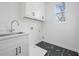 Bright laundry room with cabinet storage and modern sink at 1137 Hardee Ne St # B, Atlanta, GA 30307