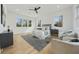 Main bedroom featuring large windows, hardwood flooring, and a decorative rug at 1137 Hardee Ne St # B, Atlanta, GA 30307