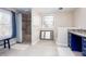 Bright bathroom showcasing a walk-in shower, stained glass window, and vanity with granite counters at 2370 Huckleberry Ln, Lithia Springs, GA 30122