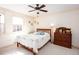 Inviting bedroom with a ceiling fan, neutral walls and beautiful natural light at 2370 Huckleberry Ln, Lithia Springs, GA 30122