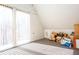 Bright bedroom featuring large windows that fill the room with natural light and gray carpeting at 2370 Huckleberry Ln, Lithia Springs, GA 30122