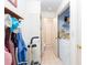 Well-organized laundry room with storage shelves and a tiled floor at 2370 Huckleberry Ln, Lithia Springs, GA 30122