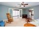 Bright living room with doors leading to a sunroom, perfect for relaxing and entertaining at 2370 Huckleberry Ln, Lithia Springs, GA 30122