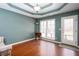 Cozy living room with hardwood floors, a tray ceiling and exterior access at 2370 Huckleberry Ln, Lithia Springs, GA 30122