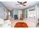 Spacious living area featuring carpet floors, a ceiling fan, and a sunroom at 2370 Huckleberry Ln, Lithia Springs, GA 30122