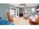 Comfortable living room with a ceiling fan and doors leading to the porch at 2370 Huckleberry Ln, Lithia Springs, GA 30122