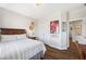 Comfortable bedroom with wood-look flooring, natural light, and neutral color scheme at 3916 Woodruff Park Way, Buford, GA 30519