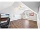 Versatile bonus room with vaulted ceilings, a TV area, and vinyl plank flooring at 3916 Woodruff Park Way, Buford, GA 30519