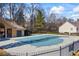 Community pool with fence and gate surrounded by trees at 3916 Woodruff Park Way, Buford, GA 30519