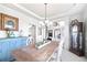 Charming dining room featuring a wooden table with seating and blue accents at 3916 Woodruff Park Way, Buford, GA 30519