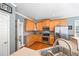 Well-lit kitchen featuring wood cabinets, stainless steel appliances, and hardwood flooring at 3916 Woodruff Park Way, Buford, GA 30519