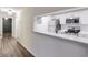 Well-lit kitchen with stainless steel appliances and breakfast bar at 128 Warm Springs Cir, Roswell, GA 30075