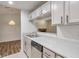 Kitchen area with sink and view to the living room's fireplace at 128 Warm Springs Cir, Roswell, GA 30075