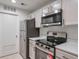 Modern kitchen featuring stainless steel appliances and plenty of storage at 128 Warm Springs Cir, Roswell, GA 30075