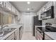 Efficient kitchen design with stainless steel appliances and white cabinetry at 128 Warm Springs Cir, Roswell, GA 30075