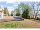 Relaxing backyard patio featuring an above-ground hot tub and mature trees at 2030 Brook Meadow Dr, Alpharetta, GA 30005