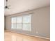 Cozy bedroom featuring a ceiling fan and large window offering plenty of natural light at 2030 Brook Meadow Dr, Alpharetta, GA 30005