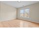 Inviting bedroom featuring gleaming hardwood floors and a bright window at 2030 Brook Meadow Dr, Alpharetta, GA 30005