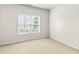 A bright empty bedroom with a large window offers views of the outdoors at 2030 Brook Meadow Dr, Alpharetta, GA 30005