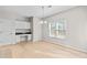 Dining room with a built in desk, light wood floors, and big windows at 2030 Brook Meadow Dr, Alpharetta, GA 30005