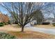 Traditional home with a long driveway and a manicured front yard at 2030 Brook Meadow Dr, Alpharetta, GA 30005