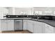 Modern kitchen features sleek black countertops and white cabinets at 2030 Brook Meadow Dr, Alpharetta, GA 30005