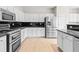 Renovated kitchen with stainless steel appliances and granite countertops at 2030 Brook Meadow Dr, Alpharetta, GA 30005