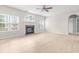 Bright living room features a fireplace and light wood floors at 2030 Brook Meadow Dr, Alpharetta, GA 30005