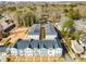 Aerial view of newly constructed townhomes nestled amongst mature trees in a residential neighborhood at 3165 Dogwood Dr # 108, Hapeville, GA 30354