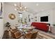 Bright dining room with seating for six and stylish chandelier at 3165 Dogwood Dr # 108, Hapeville, GA 30354