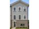 Charming two-story townhome exterior featuring gray siding, brick accents and white-framed windows at 3165 Dogwood Dr # 108, Hapeville, GA 30354