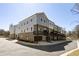 Modern townhouse complex with garages, balconies, and neutral colored facades for an upscale look at 3165 Dogwood Dr # 108, Hapeville, GA 30354