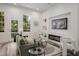 Modern living room with a green sofa, decorative fireplace, TV and large windows at 3165 Dogwood Dr # 108, Hapeville, GA 30354