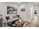 Cozy upstairs sitting area with sofa, accent pillows, and a stylish cowhide rug at 3165 Dogwood Dr # 108, Hapeville, GA 30354