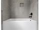 A minimalist bathtub with gray tiled walls and black hardware at 508 Price Rd, Carrollton, GA 30116