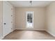 A simple bedroom with wood-look flooring and a bright view of the backyard at 508 Price Rd, Carrollton, GA 30116