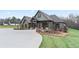 Stunning craftsman home with a circular driveway, lush landscaping, and a welcoming front porch at 508 Price Rd, Carrollton, GA 30116