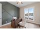 Modern office showcasing an accent wall, wood desk, and bright window view at 508 Price Rd, Carrollton, GA 30116