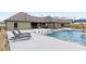 Luxury backyard featuring a pool with tanning chairs, patio with dining, and scenic views at 508 Price Rd, Carrollton, GA 30116