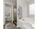 Bathroom featuring a soaking tub with gold hardware and a separate shower at 51 Brookshire Ct, Dallas, GA 30157