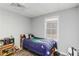 Bedroom with wood-look floors, bright window, and kid friendly decor at 51 Brookshire Ct, Dallas, GA 30157