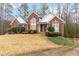 Attractive brick house with lush landscaping and a curved walkway leading to the entrance at 51 Brookshire Ct, Dallas, GA 30157