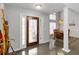 Elegant foyer with a decorative glass front door, hardwood floors, and a view of the dining area at 51 Brookshire Ct, Dallas, GA 30157