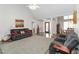 Open-concept living room with a view of the dining area and a decorative front door at 51 Brookshire Ct, Dallas, GA 30157