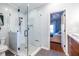 Beautiful bathroom featuring a glass shower enclosure and tiled walls, complemented by modern fixtures and neutral color palette at 1063 Emerson Avenue Se, Atlanta, GA 30316